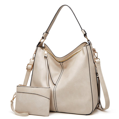 Ersilia™ - Elegant leather bag with large capacity and side pockets