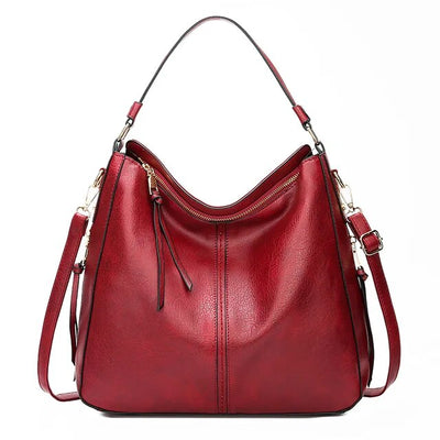 Ersilia™ - Elegant leather bag with large capacity and side pockets